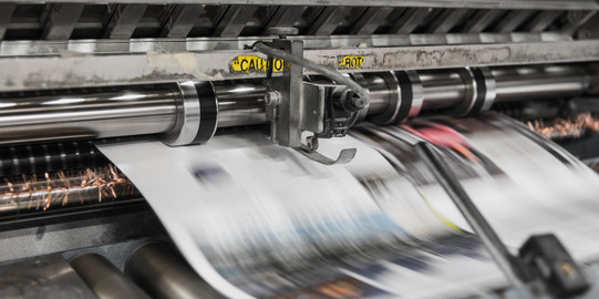 Printing press releases printed paper.